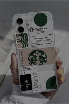 a starbucks phone case with stickers on it