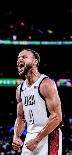 a male basketball player with his mouth open and tongue out in front of the crowd