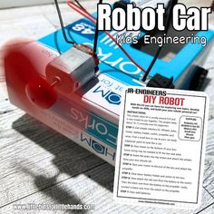 the robot car is sitting on top of a book with instructions for how to use it