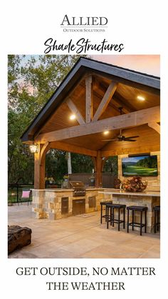 an outdoor kitchen and grill area with the words get outside, no matter the weather