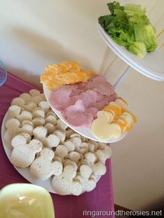 a table topped with plates and bowls filled with food