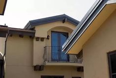 an apartment building with a balcony and balconies