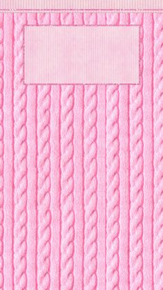 a close up of a pink blanket with a white label on the top of it