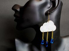 "Even rainy days can be beautiful with these stunning cloud earrings with dangle raindrops. Earrings are acrylic with nickel free gold chains and ear wire. Earrings are 1 3/4 wide, and 3\" long, with a 4\" drop length to the lowest raindrop." Drop Chandelier Earrings As A Gift, Drop Chandelier Earrings For Gift, Single Drop Chandelier Earring As Gift, Handmade Drop Earrings, Cloud Earrings, A Rainy Day, Be Beautiful, Delicate Earrings, Wire Earrings