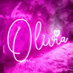 the word olvia written with neon lights in front of purple feathered wallpaper