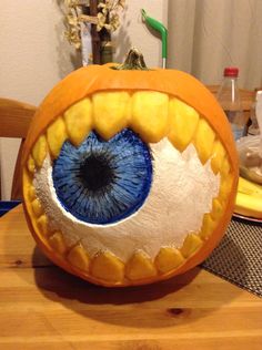 a pumpkin with an eye painted on it