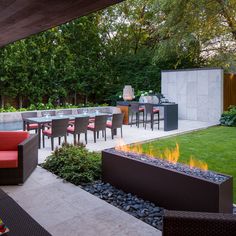 an outdoor patio with fire pit and seating area