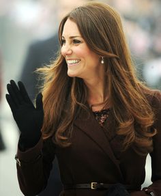 the duke waves to his fellow as he walks down the street