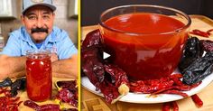 a man sitting at a table next to a jar of chili sauce and a plate with peppers on it