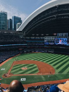 an empty baseball stadium filled with lots of people