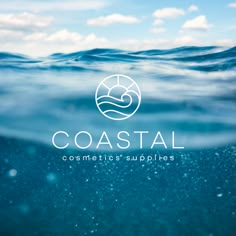 the logo for coastal cosmetics supplies, which is under water with blue sky and clouds in the background