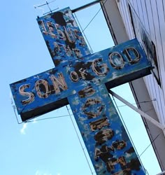 a large blue cross on the side of a building