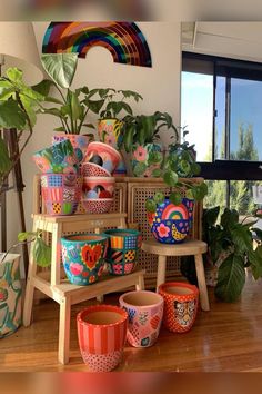 colorful pots and planters are on display in the living room