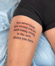 a woman with a tattoo saying you never know how strong you are until being strong is the only choice you have