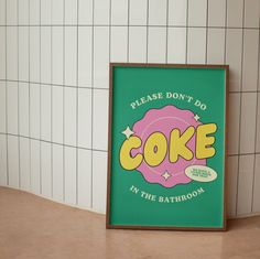 a green sign that says, please don't do cake in the bath room