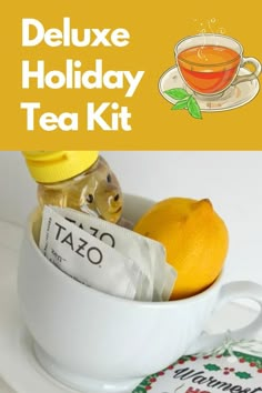 a cup filled with tea and oranges on top of a white plate next to a bag