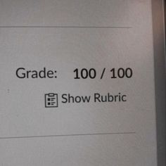 a sign that says grade 100 / 100 show rubric