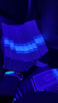 purple and blue lights are shining on the back seat of a car in the dark