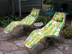 two lawn chairs sitting on top of a stone patio