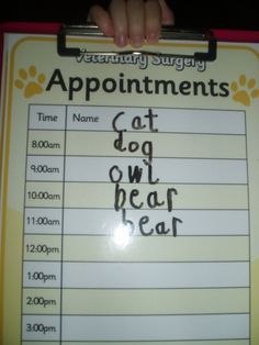 a sign that says appointments for cats and dogs with paw prints on the front