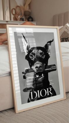 a black and white photo of a dog with the word dior on it's face