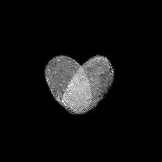 a fingerprint in the shape of a heart on a black background with white lines