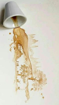 coffee spilled on the floor next to a light fixture with water coming out of it