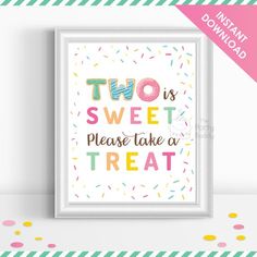 a framed poster with the words two is sweet please take a treat in pink, yellow and