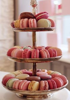 three tiered trays filled with different types of macaroons