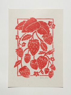 a drawing of strawberries in a square frame with leaves and berries on the side