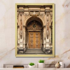 an ornate doorway with a clock on the wall above it is framed in yellow wood