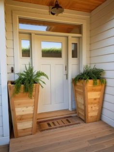 two wooden planters sitting on the front porch