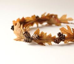 a headband made out of leaves and acorns