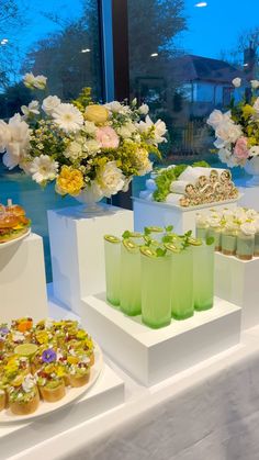 there are many different desserts on display in the window sill at this event