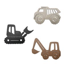 three metal dies with construction vehicles on the front, one in black and one in brown