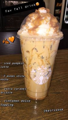 the iced pumpkin latte is topped with whipped cream and caramel