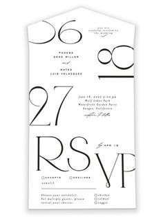 the black and white wedding stationery is printed on top of an envelope with numbers