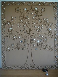 a decorative wall hanging made out of clay