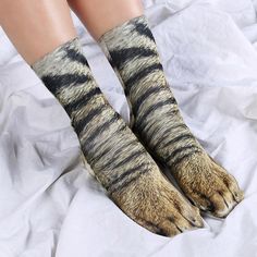 Have you ever dreamt of taking a walk on the wild side? Well, now you can, thanks to these funky, crew-length Animal Paw socks, which will transform your feet into 10 different animal paws. Get rid of your old, boring socks and spice up the sock drawer with these. Features: Material: 100% Polyester which is soft on the skin. Length: Crew-length Fun options to choose from: Turn your feet into animal feet with these Paw Print Socks. 10 options available which are Cat, Dog, Elephant, Dinosaur, Tige Animal Paws, Animal Print Socks, Paws Socks, Print Socks, Sock Drawer, Cat Socks, Sock Animals, Funny Socks, Shoe Covers