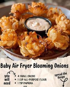 baby air fryer blooming onions on a plate with dipping sauce