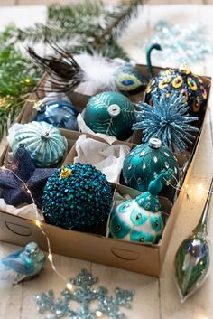 an open box filled with ornaments on top of a table