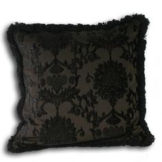 a black and grey pillow on a white background