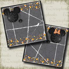 two mickey mouse ears with candy in them on top of a halloween themed greeting card