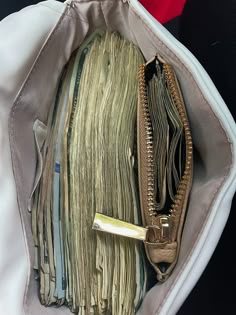 an open purse filled with lots of papers