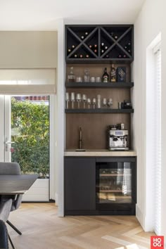 a wine rack in the corner of a dining room