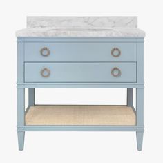 a blue vanity with marble top and drawers