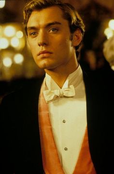 a young man in a tuxedo and bow tie