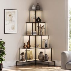 a corner shelf with vases and other items on it in a living room setting