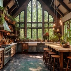 a kitchen filled with lots of counter top space next to a large window covered in plants