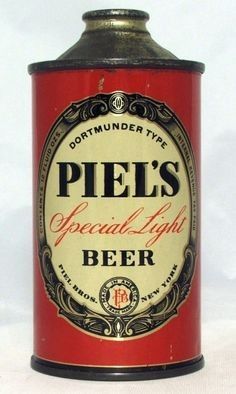 an old tin can that is red and black with the words pie's special light beer on it